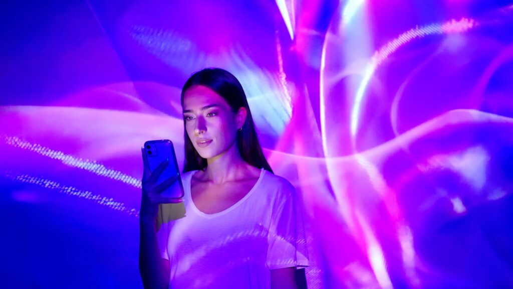 person experiencing vibroacoustic therapy with water and sound waves visualized