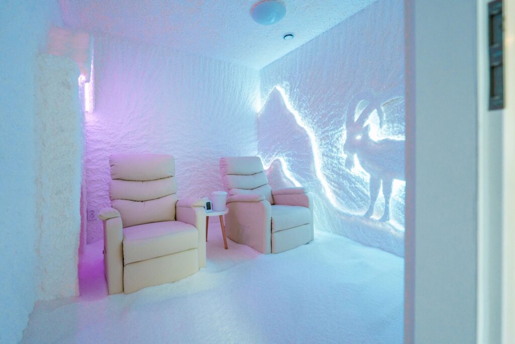 serene therapy room with soft blue lighting and modern sound therapy device